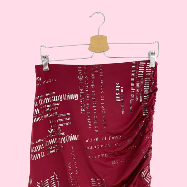 BURGUNDY WORD PRINT ASYMMETRICAL MIDI SKIRT (M/L)