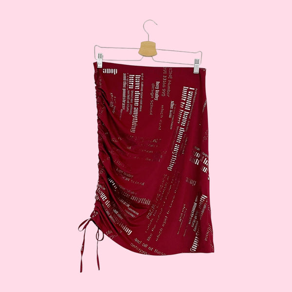 BURGUNDY WORD PRINT ASYMMETRICAL MIDI SKIRT (M/L)